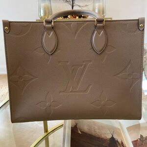 NWT Louis Vuitton “Onthego MM” — Monogram Empreinte Leather in Turtledove